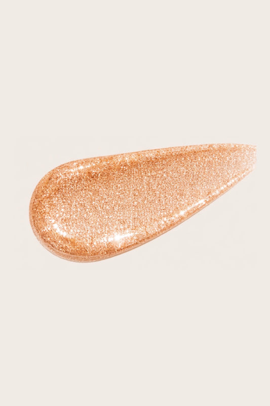 Texture swatch of 03 Golden Hour skincare-infused glow drops, a warm bronze vegan liquid illuminator featuring a buildable liquid shimmer suitable for all skin tones.