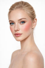 Honor The House Golden Cheek Cream Blush in 01 Sun Kiss on blonde model with blue eyes.