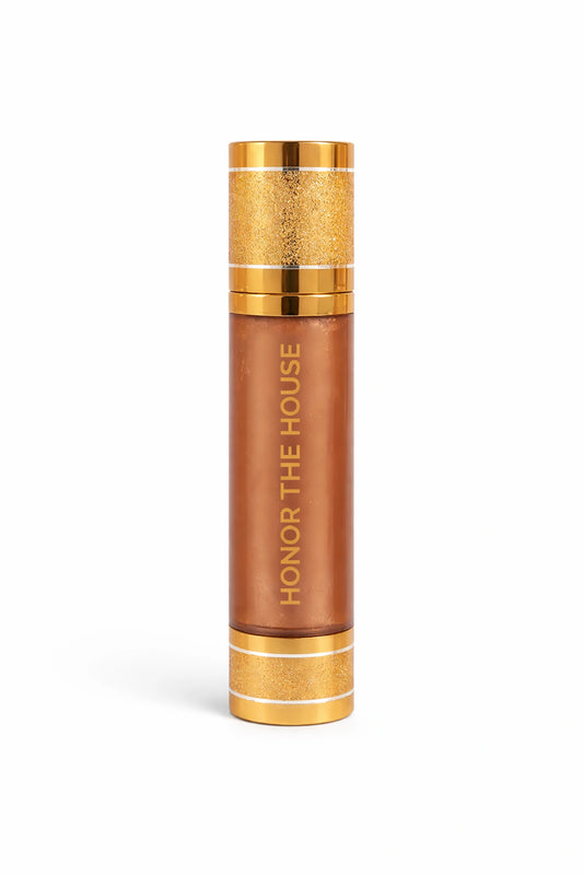 Honor the House Drippin' Gold Liquid Highlighter in shade 'Golden Hour,' a champagne-toned vegan liquid illuminator for a natural lit-from-within glow on light to medium skin tones.