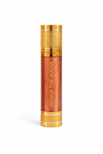 Honor The House Drippin Gold Body Glow in Sun Heat being showcased with a plain white background.