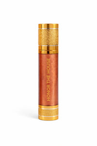 Honor The House Drippin Gold Body Glow in Sun Heat being showcased with a plain white background.