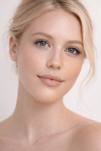 Sun Struck vegan liquid foundation on beautiful blonde hair and blue eyed model by Honor The House