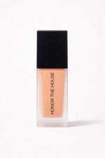 Warm Mirage vegan liquid foundation in its original packaging by Honor The House