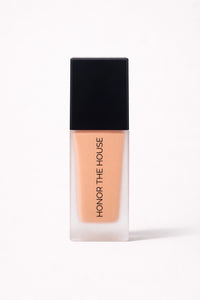 Warm Mirage vegan liquid foundation in its original packaging by Honor The House