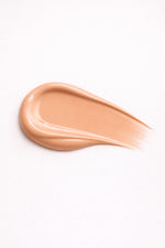 Warm Mirage vegan liquid foundation in liquid swatch form by Honor The House