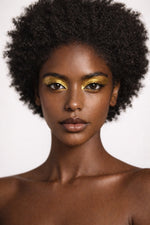 Bronze Shiva vegan liquid foundation on Ebony model with natural afro by Honor The House