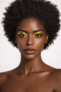 Bronze Shiva vegan liquid foundation on Ebony model with natural afro by Honor The House