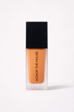 Amber Roulette vegan liquid foundation in its original packaging by Honor The House