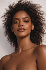 Pecan Treat vegan liquid foundation on beautiful Ethiopian model with curly hair by Honor The House
