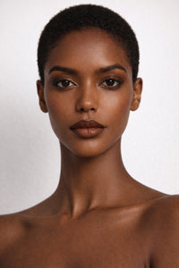 Mocha Luxe vegan liquid foundation on Ebony model with short hair by Honor The House