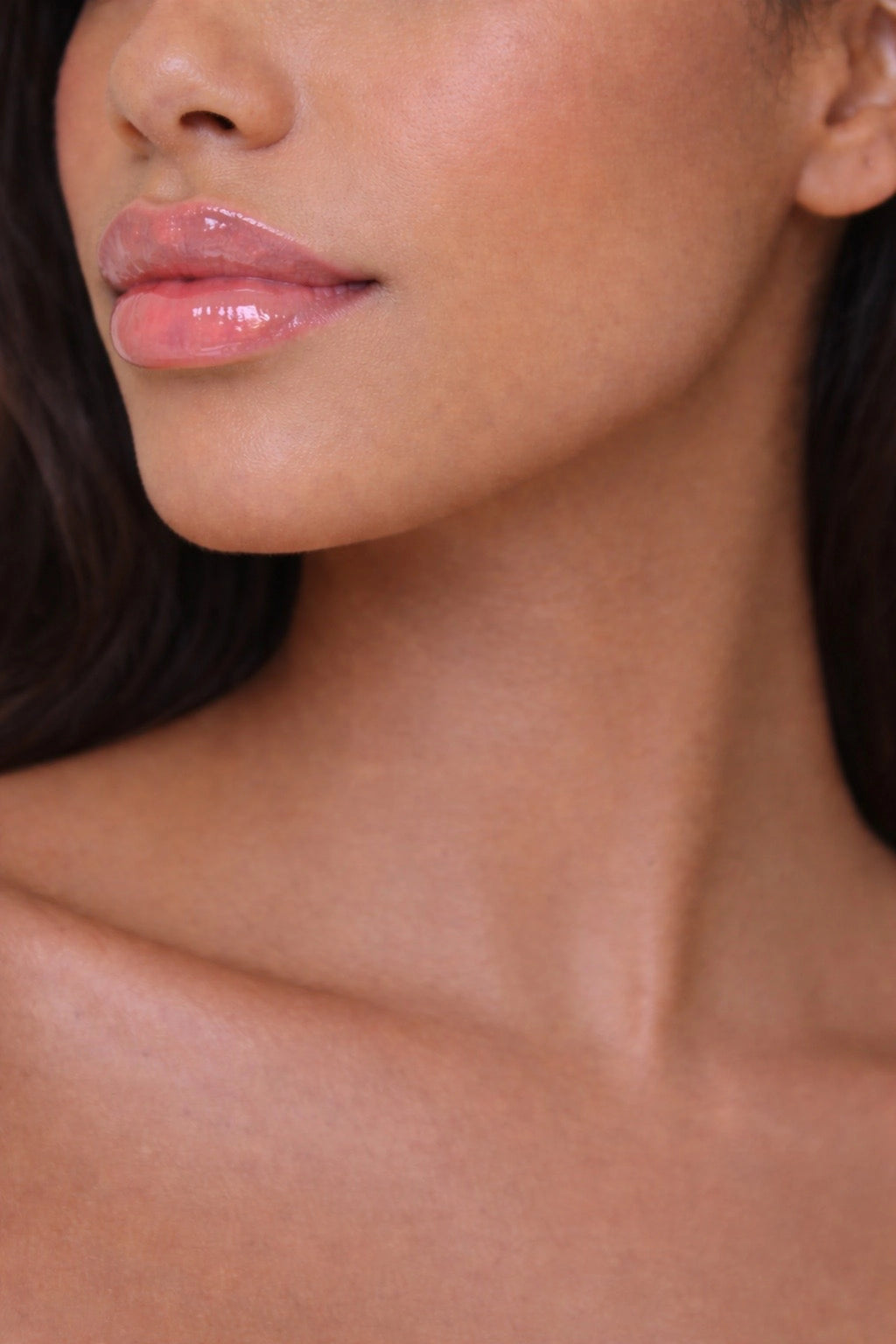 Honor The House SPF 30 Lip Balm in Cabernet Grape on Latina model's lips.