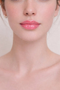 Honor The House SPF 30 Lip Balm in Cabernet Grape on white skin model's lips.