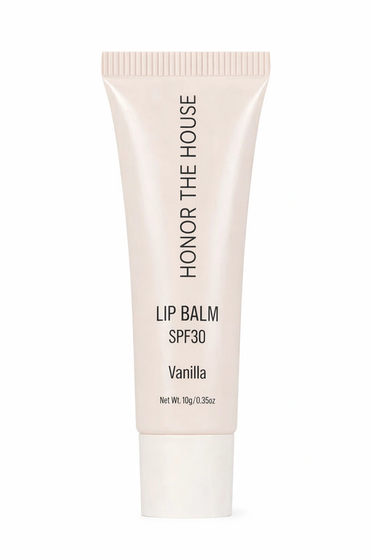 Honor the House Beauty Caribbean Sun French Vanilla SPF 30 Lip Balm in a cream-colored tube. Gourmet vanilla-scented lip sunscreen with hydrating broad-spectrum protection.