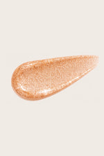 Honor The House Drippin' Gold Liquid Highlighter liquid swatch in Golden Hour.