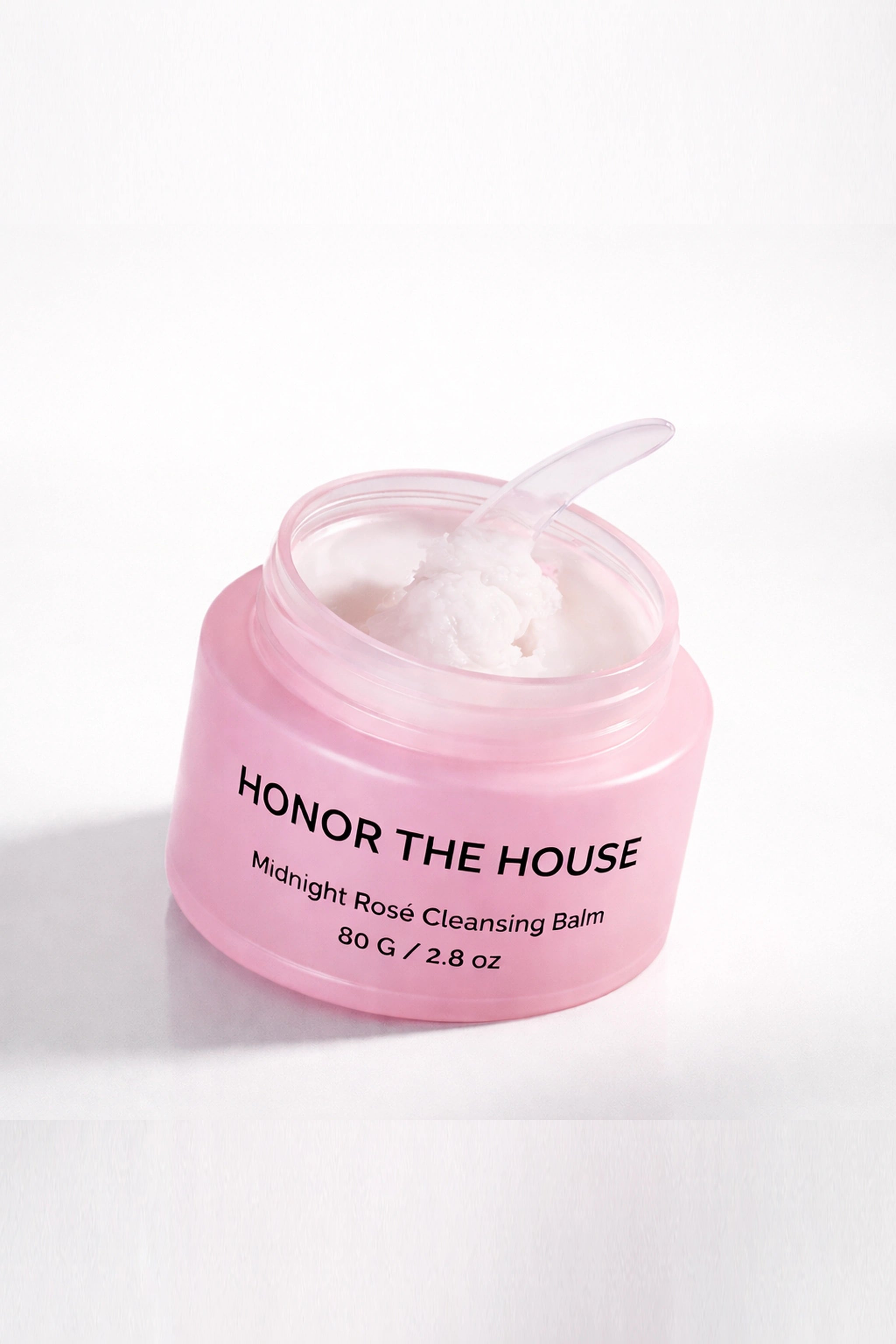 Honor The House Cleanse Your Spirit Cleansing Balm in Midnight Rosé shown with a plain white background and a spatula scoop.