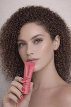 Honor The House model showcasing Caribbean Sun Sweet Strawberry with pretty red nail polish,