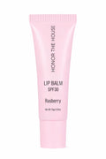 Honor The House Caribbean Sun SPF 30 Lip Balm Rum Raspberry flavor in its product packaging with off-white background.