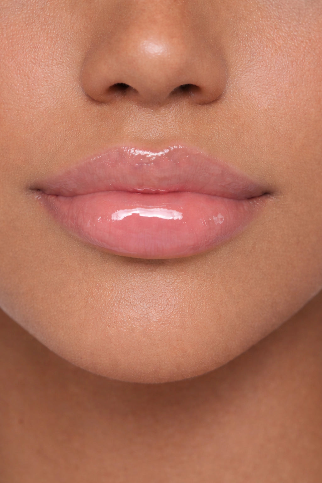 Arab model showcasing Honor The House Caribbean Sun SPF 30 Lip Balm in Rum Raspberry flavor.