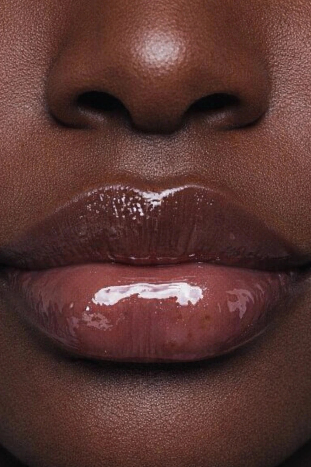 Honor The House Caribbean Sun SPF 30 Lip Balm Sweet Strawberry on darkened lips.