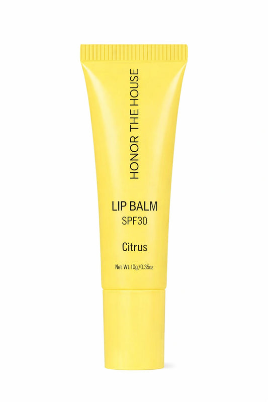 Honor the House Beauty Caribbean Sun Tropical Citrus SPF 30 Lip Balm in a yellow tube. Refreshing citrus-flavored lip protection that is 100% vegan and cruelty-free.