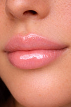 Honor The House Caribbean Sun SPF 30 Tropical Citrus on model with pink lips.