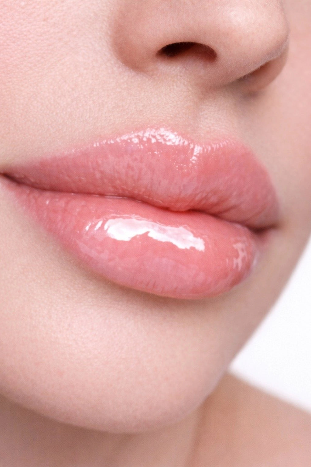 Honor The House Caribbean Sun SPF 30 Tropical Citrus on light model with pink lips.