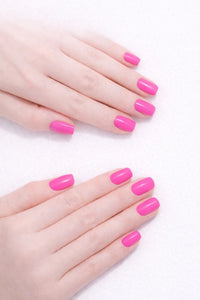 Bubble Gum Pink vegan nail polish on white model hands by Honor The House