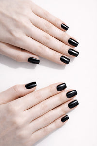 Umbreon Black vegan nail polish on white model hands by Honor The House