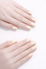 French Vanilla vegan nail polish on white model hands by Honor The House