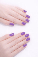 Royal Purple vegan nail polish on white model hands by Honor The House